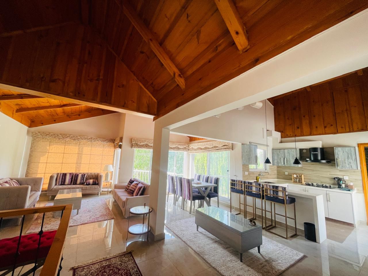 charming corner cottage with dual-sided panoramic mountain and garden views, large windows, luxury mountain architecture, golden hour lighting, corner position with enhanced privacy